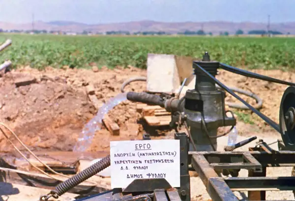 Test pumping — water discharging beside a cotton field on the Thessalian plain